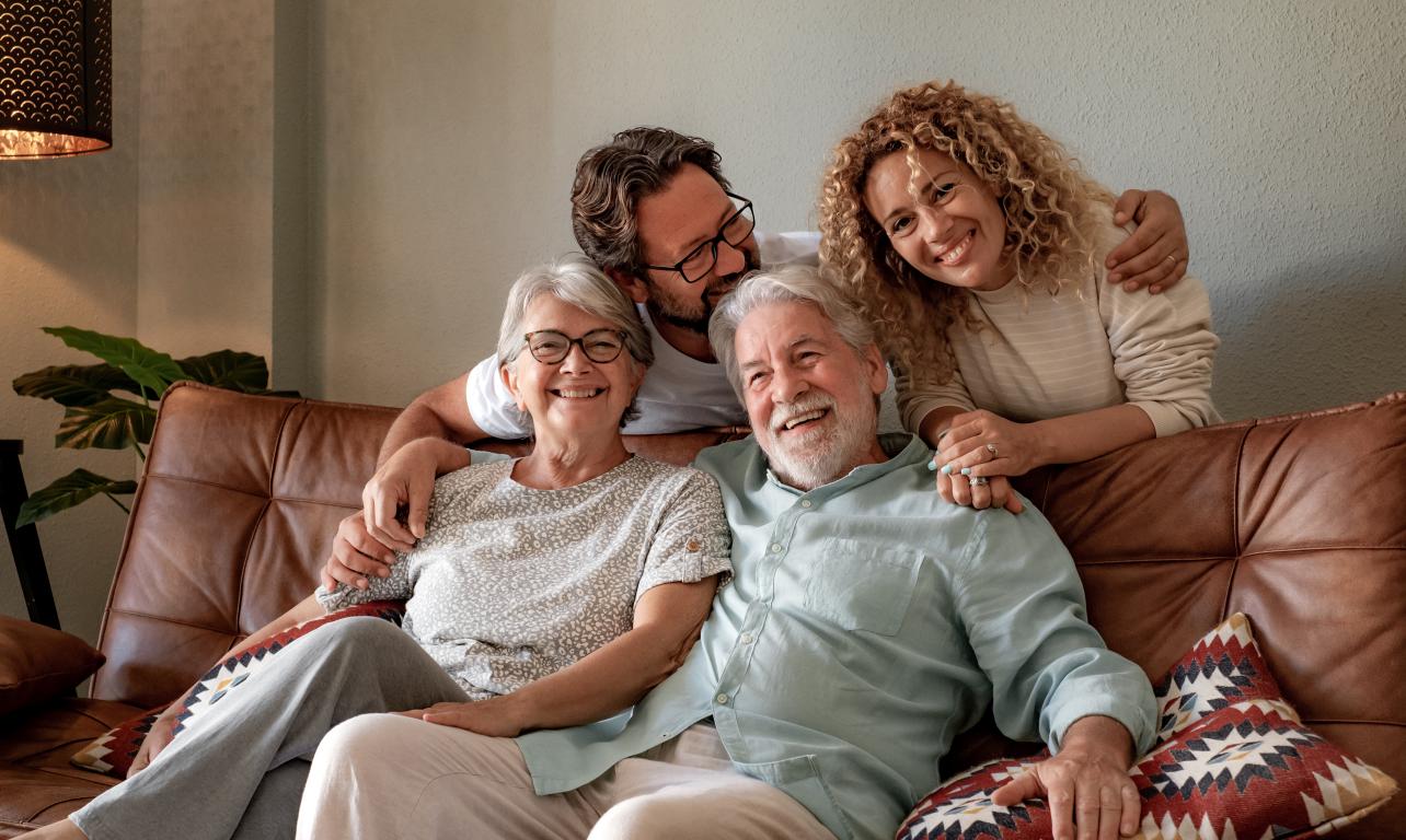 Family members share a comforting embrace, highlighting the importance of home support during recovery.