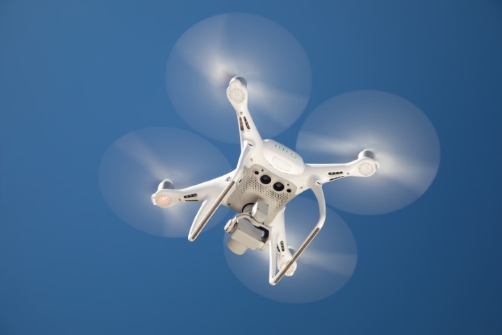 white drone in the blue sky