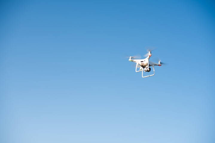 white drone in the blue sky