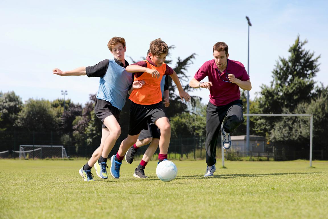 Several players chase the ball during a fast break