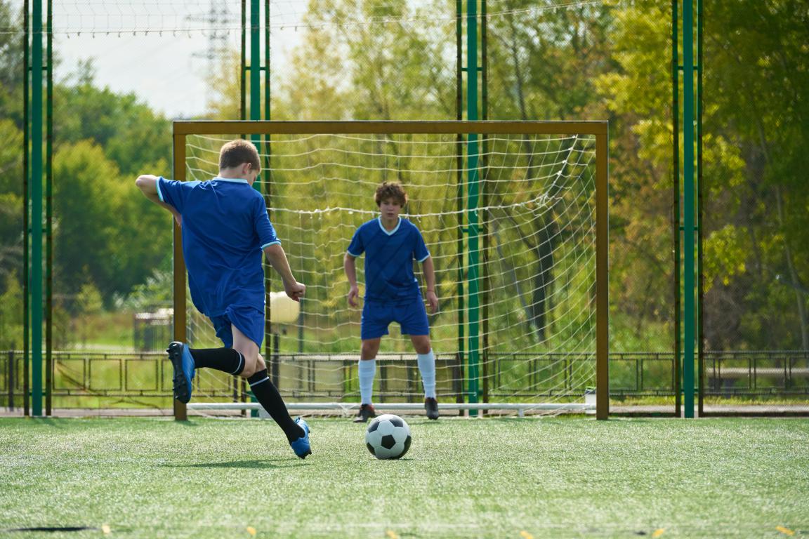 Young players practise simple drills during a training session.