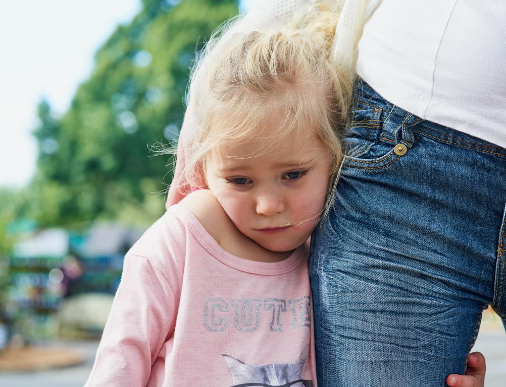 Child receiving comfort when feeling overwhelmed
