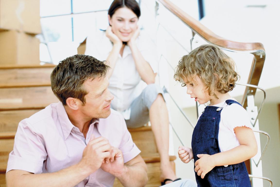 Parent explaining health information to a young child.
