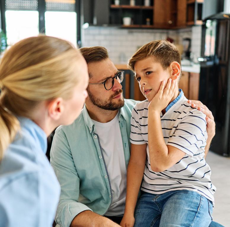 Calm conversation between parent and child about safety card.