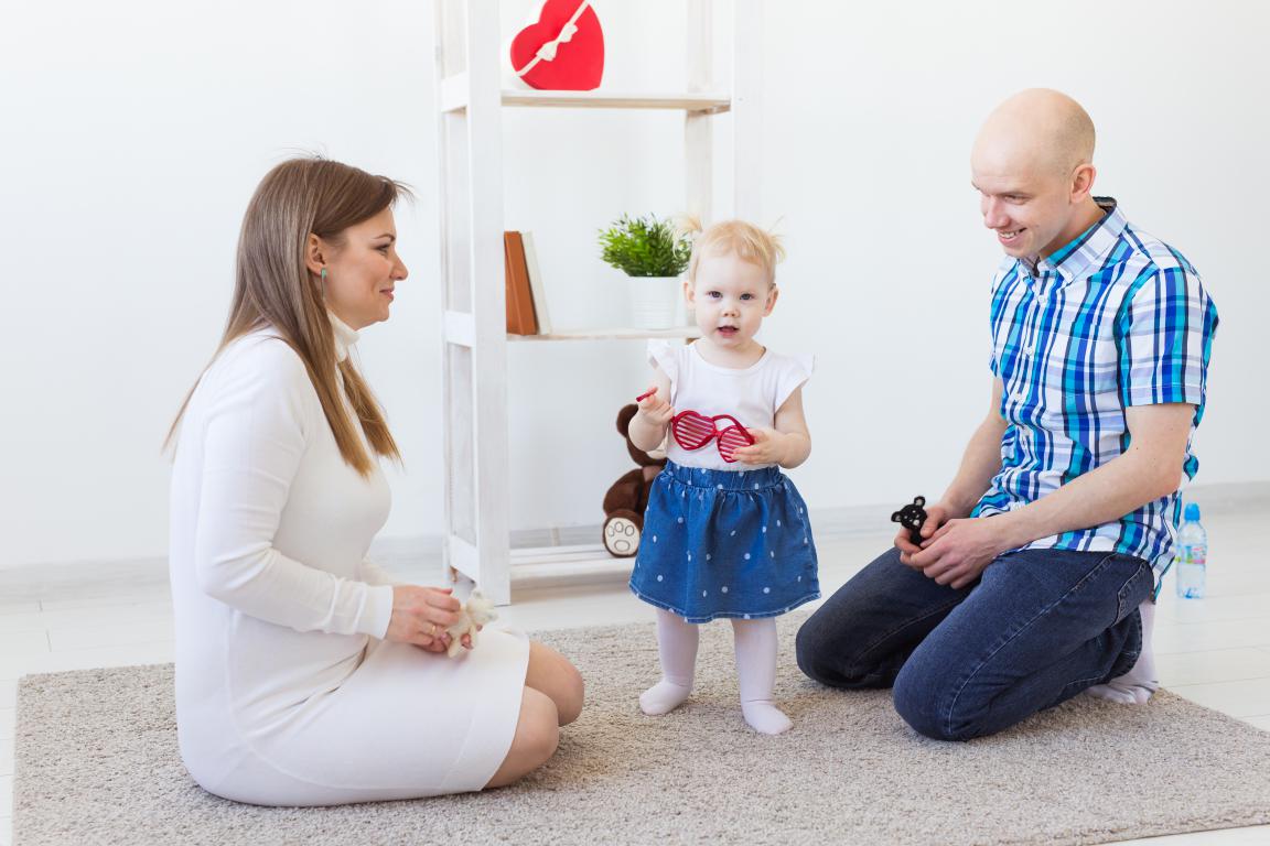 Parent guiding child on emergency health information.