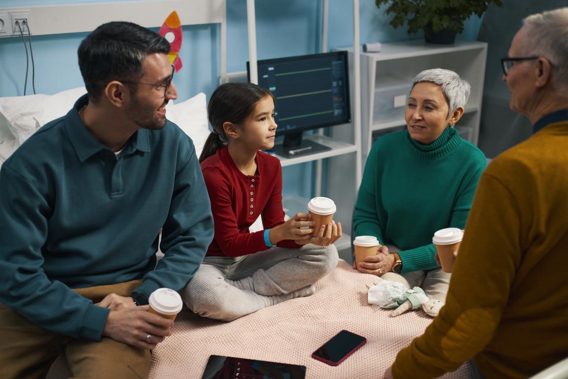 Adult explaining emergency medical details to young child.